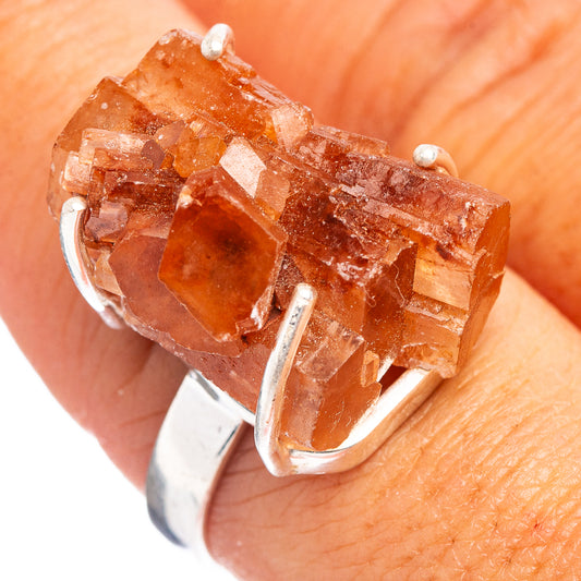 Orange aragonite gemstone ring with silver prongs and polished .925 band