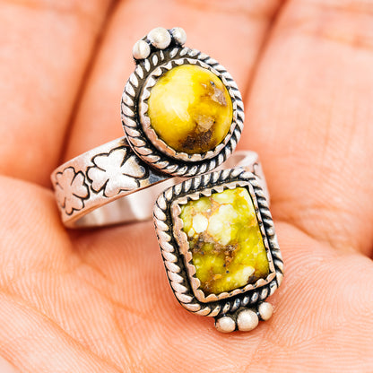Sterling silver ring with two yellow oval gemstone settings and southwest engraving