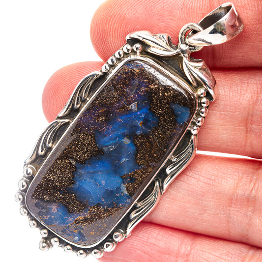 Sterling silver boulder opal pendant, oval setting with blue and gold stone face