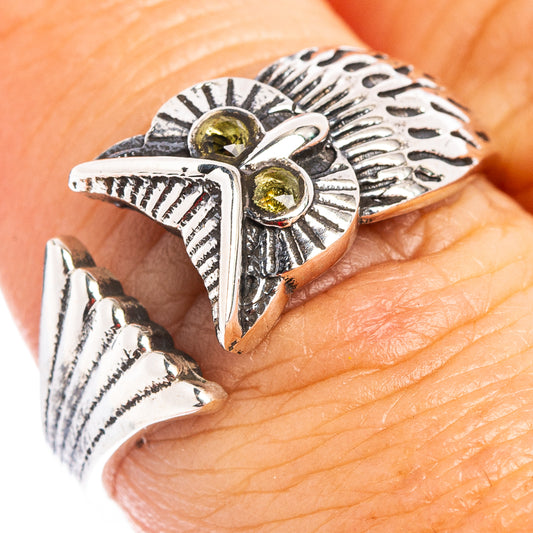 Sterling silver owl dainty ring with green peridot-style stones and openwork wings