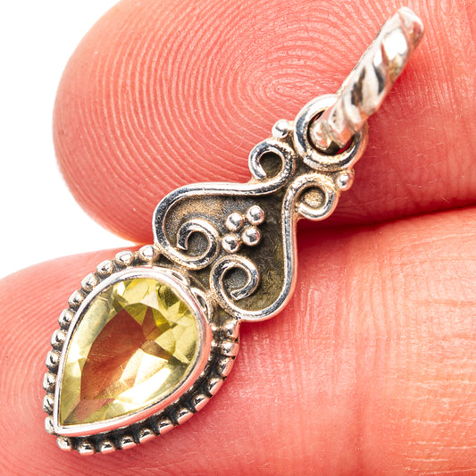 .925 sterling silver citrine pendant close-up with oval yellow gemstone and bail