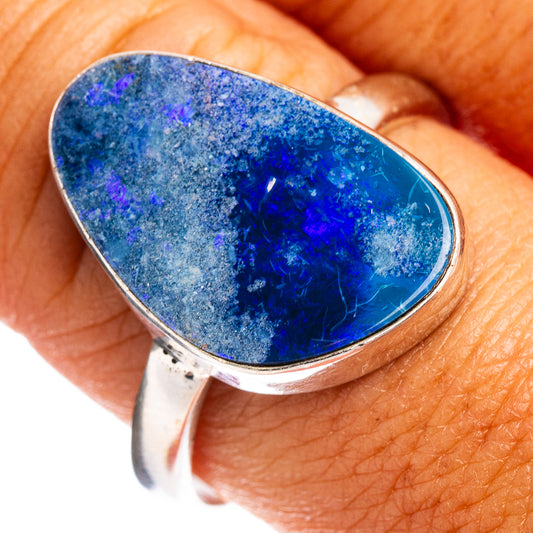 Sterling silver opal doublet ring with oval blue stone, curved bezel setting