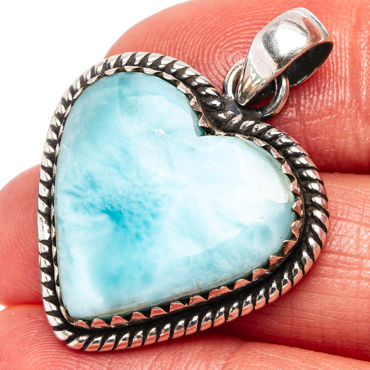 Heart-shaped larimar cabochon pendant with braided silver border, open bail