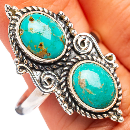 Adjustable sterling silver ring with two oval turquoise gemstones, ornate bezel setting