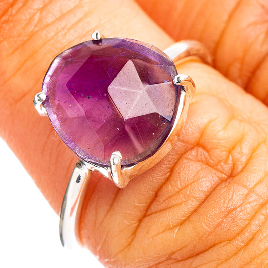 Faceted amethyst ring with oval purple gemstone and silver prong setting