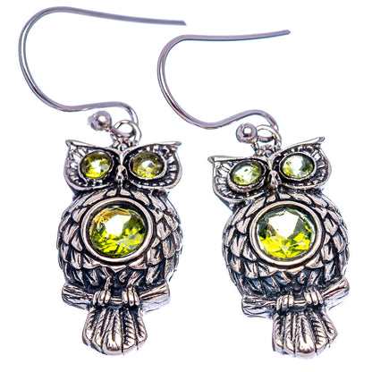 Sterling silver owl drop earrings with peridot-green round stones and fishhook wires
