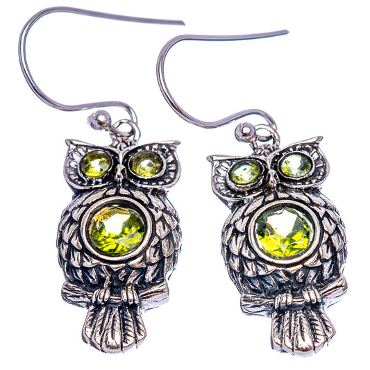Sterling silver owl drop earrings with peridot-green round stones and fishhook wires