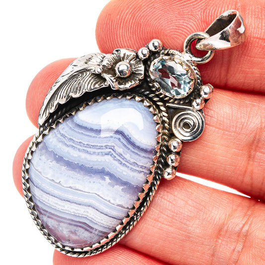 Blue lace agate oval pendant in .925 sterling silver with ornate beaded setting
