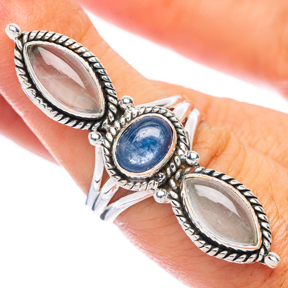 Sterling silver ring with oval blue center stone, flanked by two oval white stones