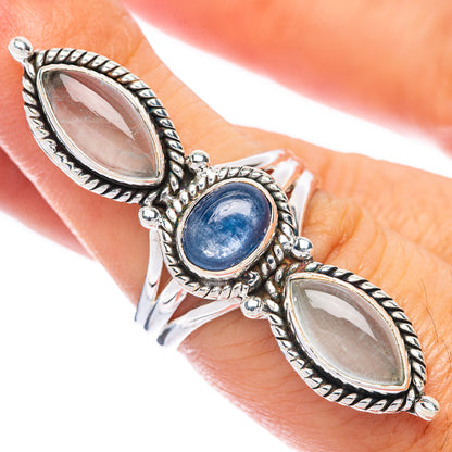 Sterling silver ring with oval blue center stone, flanked by two oval white stones