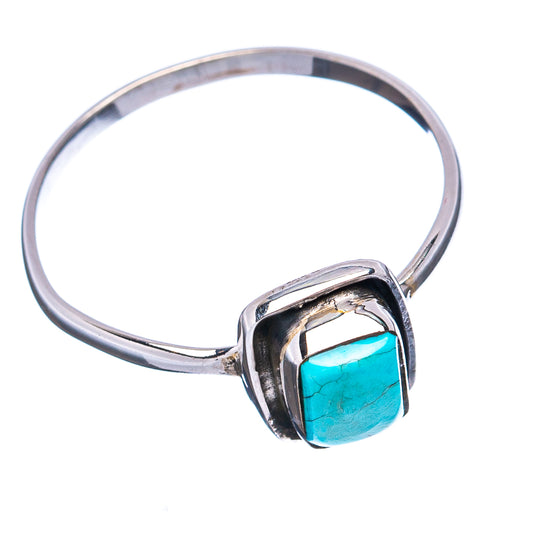 Sterling silver ring with rectangular turquoise stone in a raised square bezel