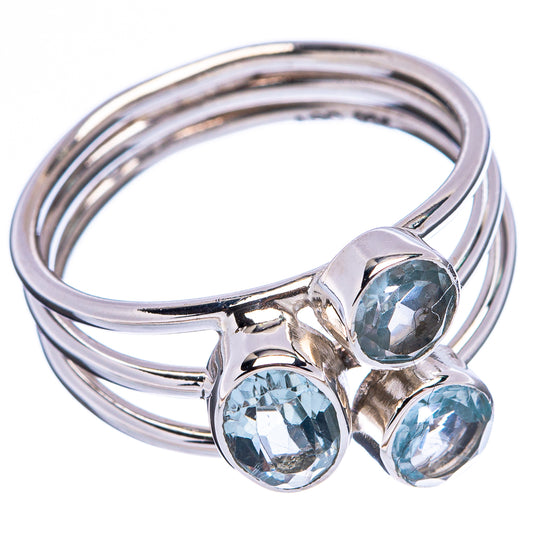 Sterling silver ring with three round blue topaz gemstones, polished band