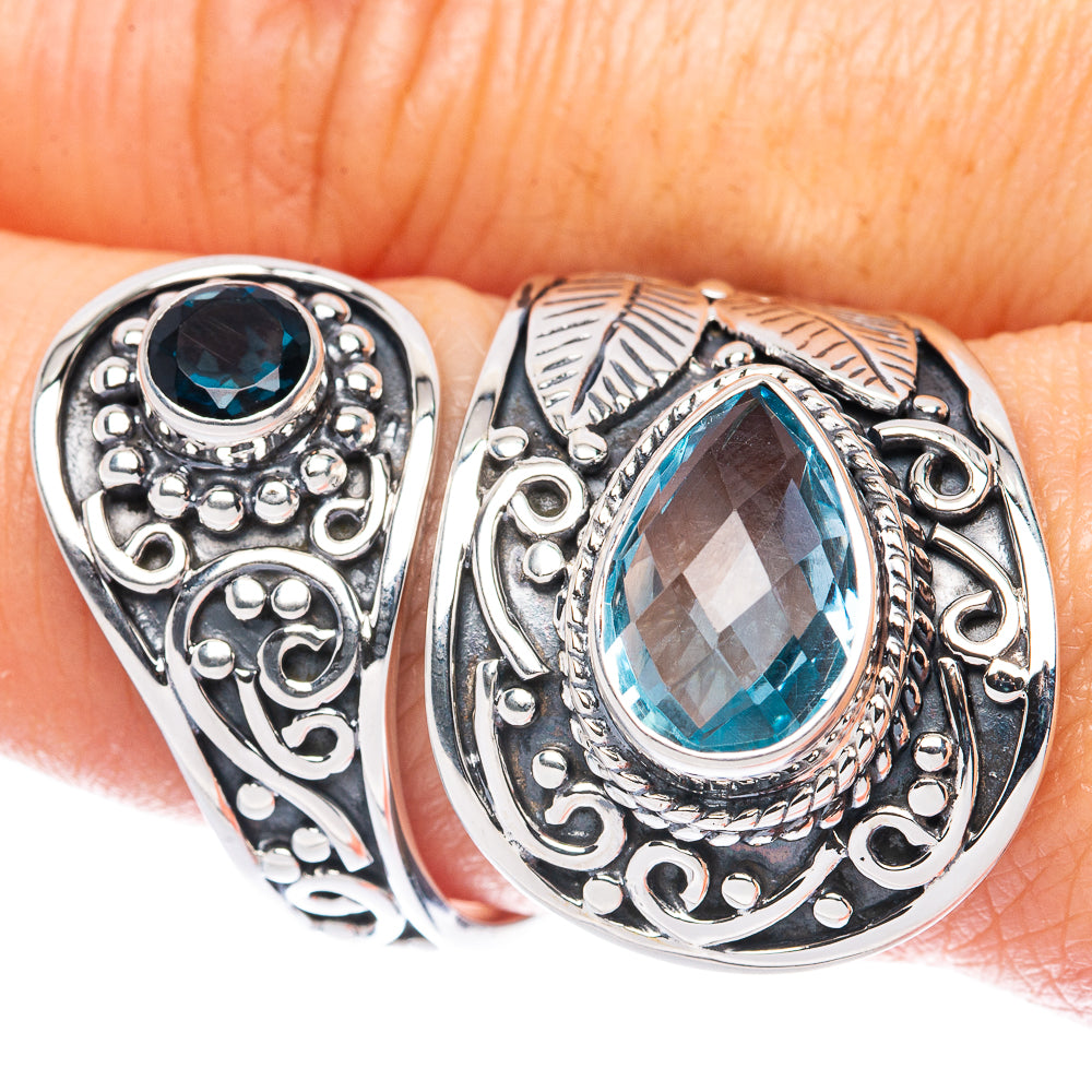 Sterling silver ring with round blue gemstone and ornate filigree setting