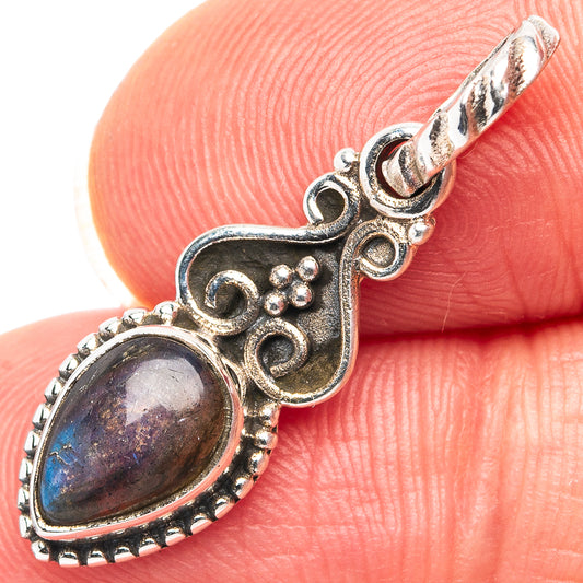 Sterling silver labradorite pendant detail with oval stone and scrollwork surround
