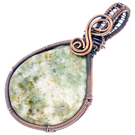 Oxidized copper wire-wrap pendant with oval green speckled stone and spiral bail
