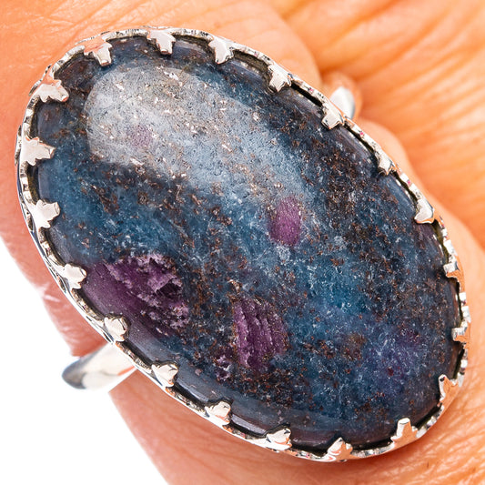 Oval sterling silver ring with blue kyanite stone, purple spots, prong-set bezel