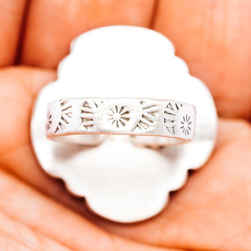 Sterling silver adjustable ring band with engraved southwestern sun and arrow pattern