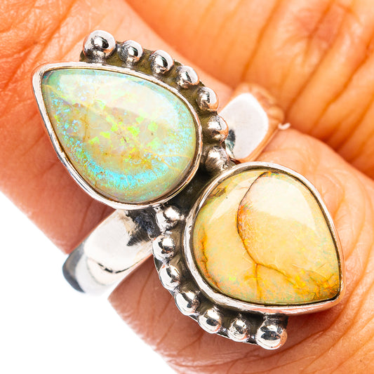 Sterling silver ring with two oval opal cabochons, green and orange iridescence