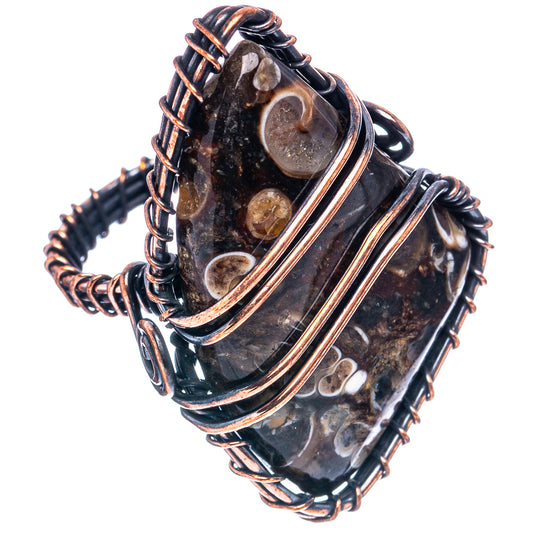 Oxidized copper wire wrap ring showing dark oval agate cabochon and double bands