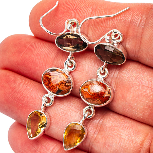 Sterling silver dangle earrings with smoky dark and amber oval gemstone drops