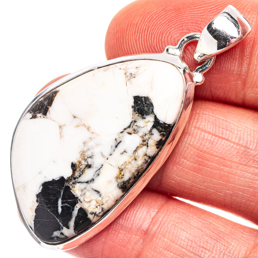 Sterling silver pendant with oval white-and-black stone cabochon and top bail loop
