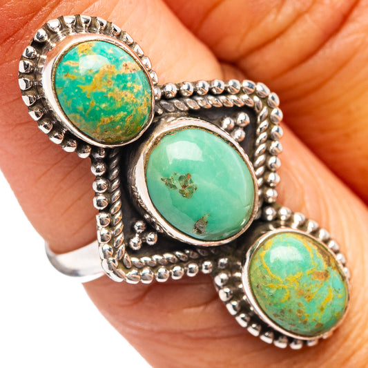 Turquoise cabochon triple-stone ring in .925 sterling silver on hand, size 6.5