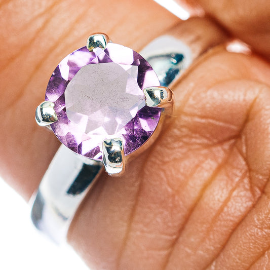 Faceted round amethyst ring with silver prongs on .925 sterling band