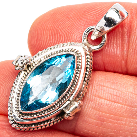 Oval faceted blue gemstone pendant in ornate .925 sterling silver setting