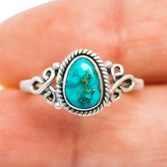Turquoise oval cabochon sterling silver ring, rope border and side scrolls