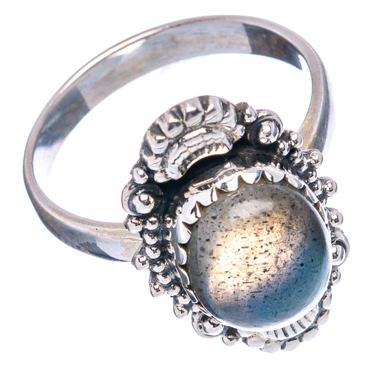 Sterling silver labradorite ring with oval blue-gray gemstone and raised ornate border