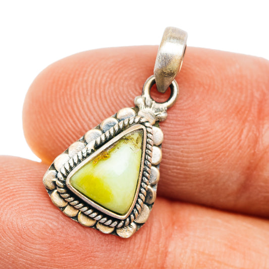 Sterling silver pendant with teardrop turquoise-style stone and beaded border.