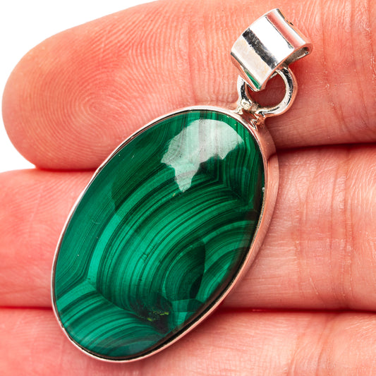 Malachite teardrop pendant in green with .925 sterling silver frame and bail