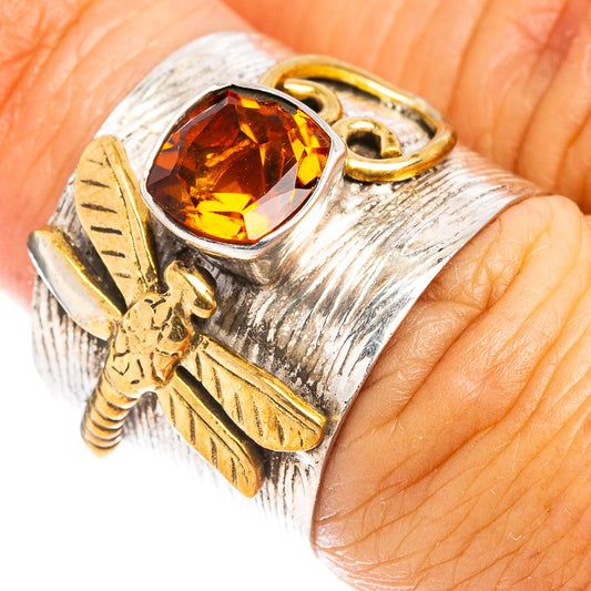 Sterling silver citrine ring with gold-toned leaf details, size 6, close-up on hand