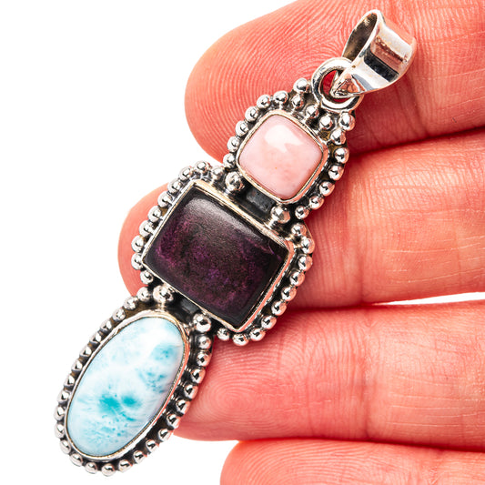 Sterling silver pendant with pink oval gemstone, dark purple square, and blue oval stone