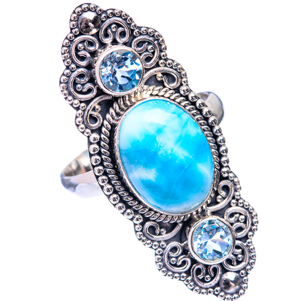 Silver filigree ring with large oval larimar stone, flanked by two round blue topaz