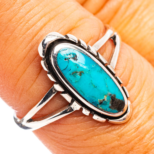 Turquoise oval bezel sterling silver ring with decorative shoulders