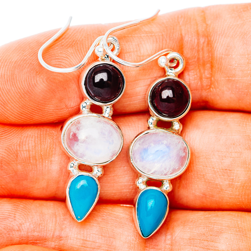Sterling silver drop earrings with garnet-red round stones, moonstone drops, and turquoise teardrops