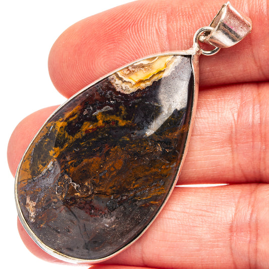 Silver-plated teardrop agate pendant with dark blue, brown, and yellow banded stone