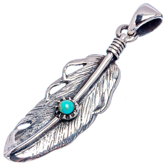 Sterling silver feather pendant detail with turquoise bead and textured feather etching