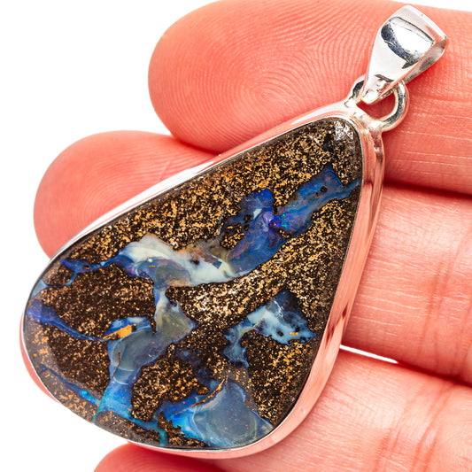 Teardrop boulder opal pendant with .925 sterling silver setting and bail