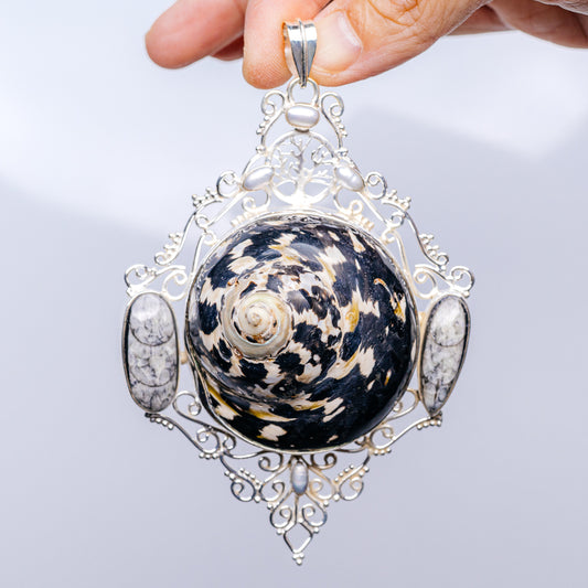 Sterling silver filigree pendant with dark patterned shell cabochon and pearl drops