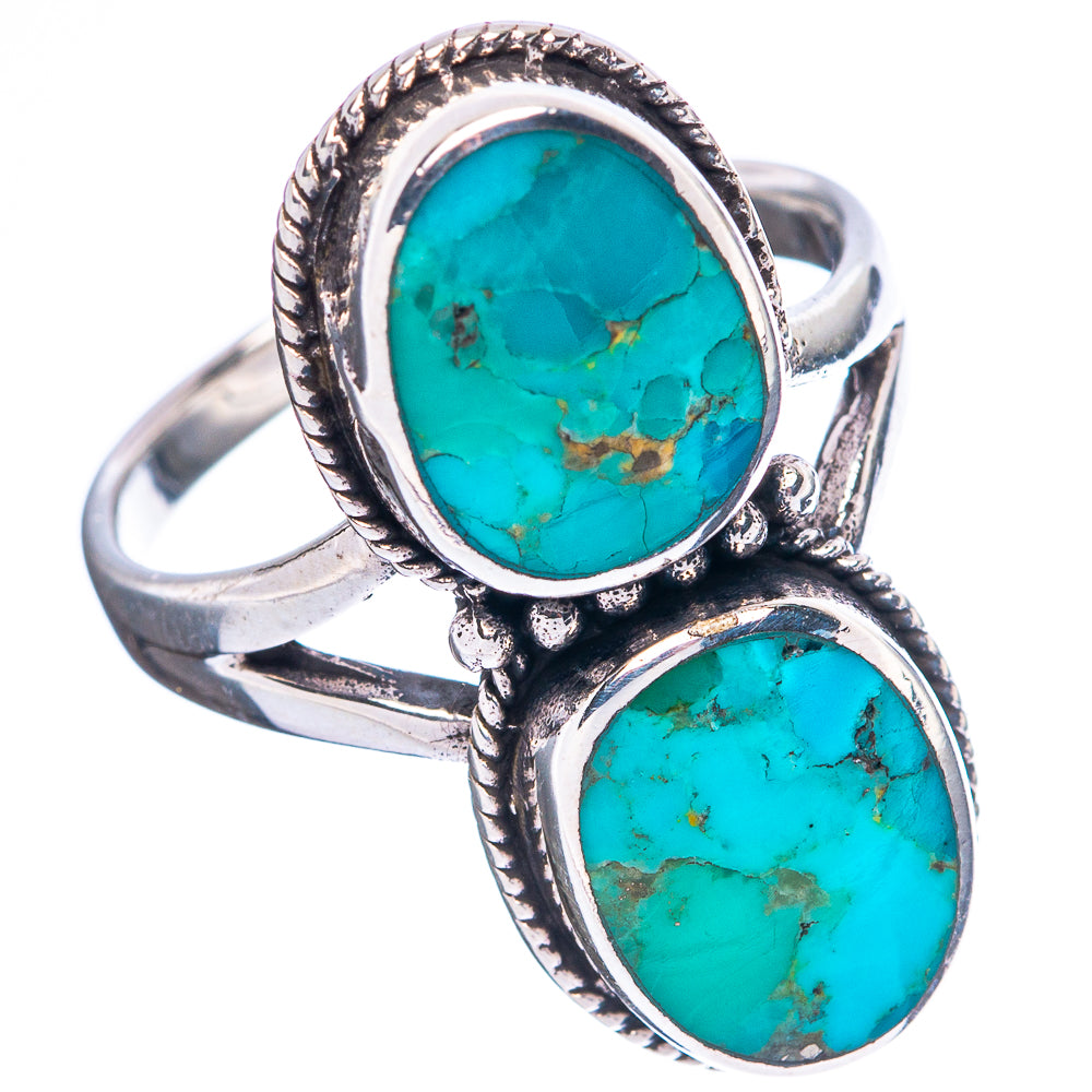 Sterling silver turquoise double-stone ring with ornate side bezels, oval cabochons