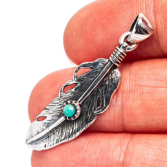 Sterling silver feather pendant with turquoise bead and faceted bail