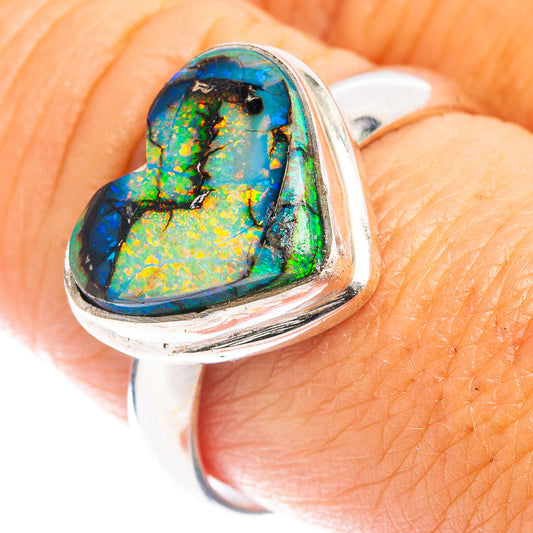 Heart-shaped opal sterling silver ring with blue-green inlay in a heart bezel