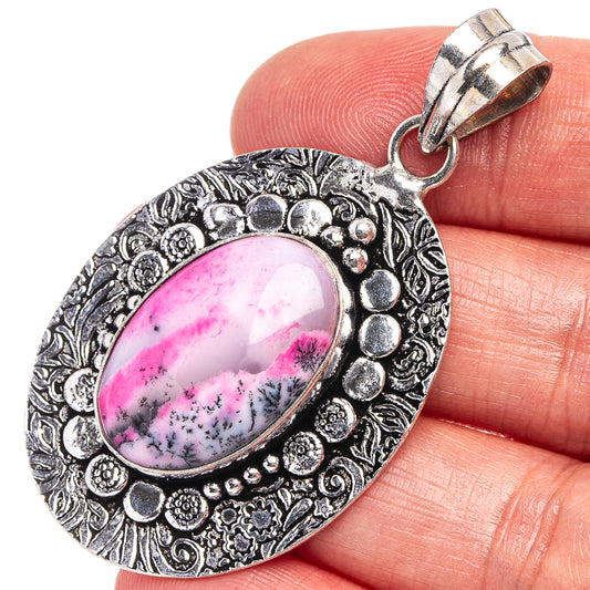 Dendritic opal pendant, oval pink stone in ornate silver-tone frame with bail