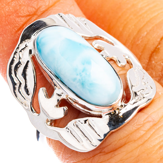 Size 6 sterling silver ring with oval blue larimar cabochon and engraved border setting