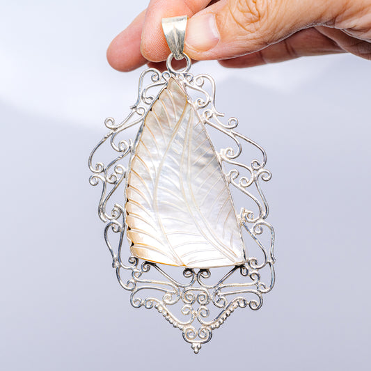 Mother of pearl pendant with ornate sterling silver frame, teardrop leaf design