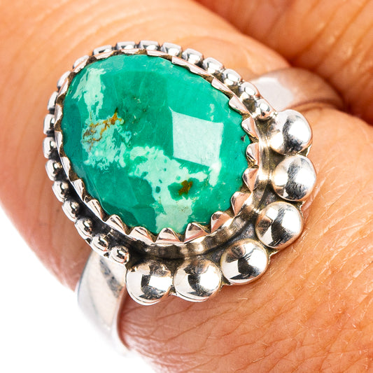 Sterling silver turquoise ring with round green cabochon and bead-set metal prongs