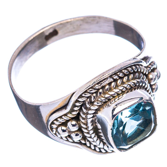 Sterling silver blue topaz ring with oval stone and detailed braided edge design