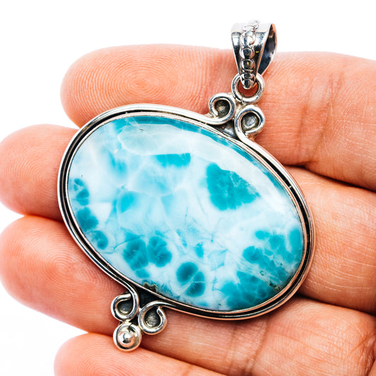 Oval larimar blue gemstone pendant in .925 sterling silver with bail